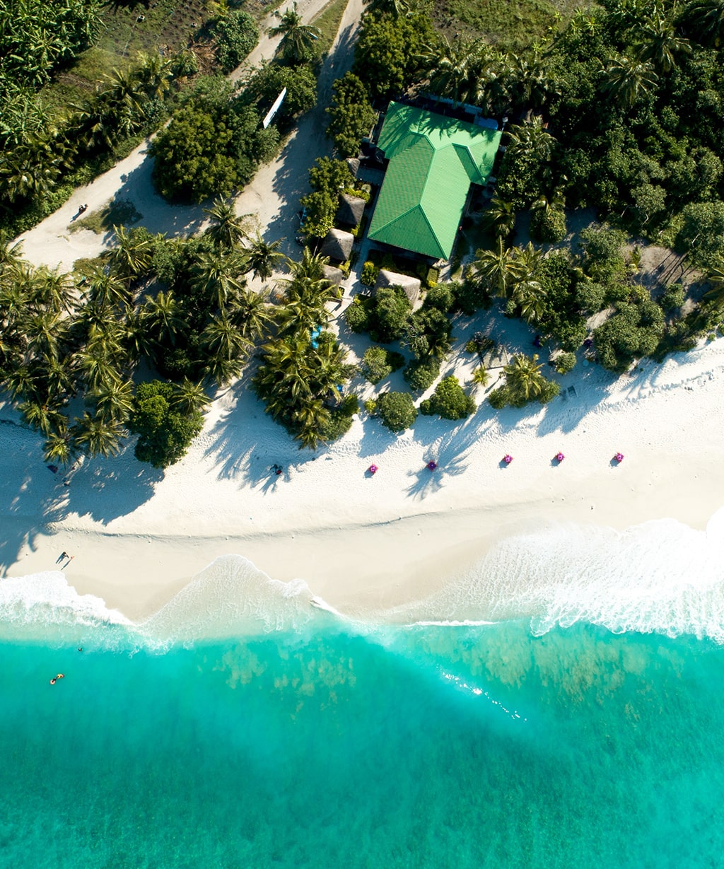 aerial-shot-maldives-showing-amazing-beach-clear-blue-sea-jungles-min