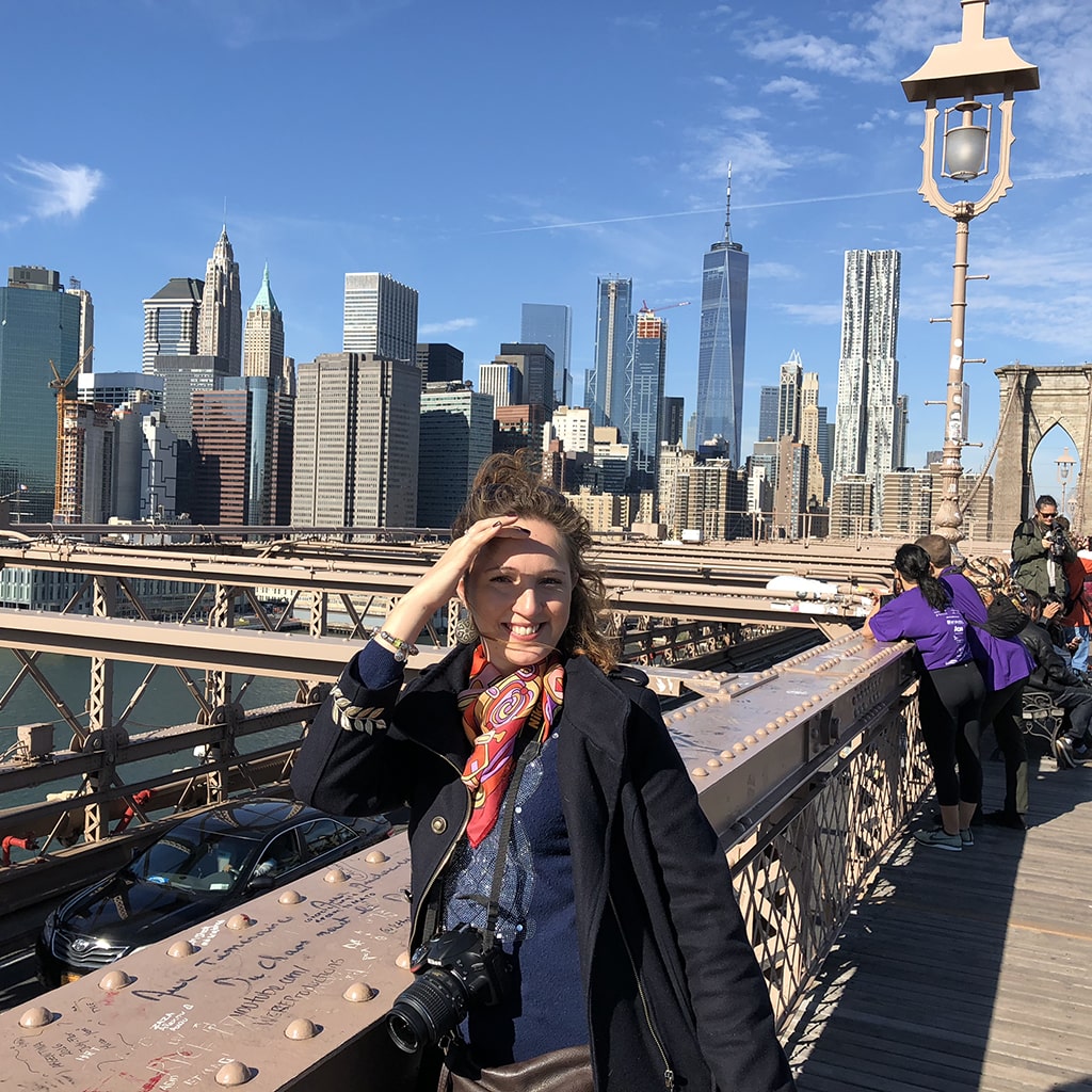 smiling-girl-bridge-smiling-min